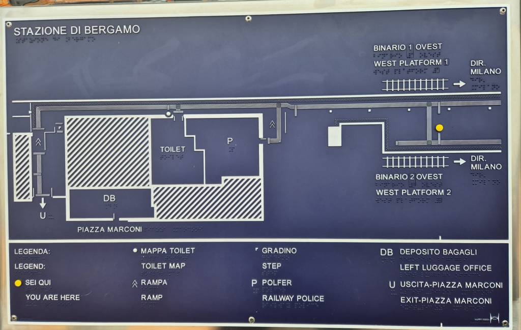 STAZIONE DI BERGAMO


BINARIO 1 OVEST
نا
لمدة
WEST PLATFORM 1
ااا؛


DIR


MILANO


TOILET


ة


DIR.
MILANO


BINARIO 2 OVEST
WEST PLATFORM 2


DB


د


PIAZZA MARCONI


LEGENDA:
LEGEND:
SEIOU
YOU ARE HERE


MAPPA TOILET
TOILET MAP


GRADINO
STEP


DB DEPOSITO BAGAGLI
LEFT LUGGAGE OFFICE


1 RAMPA
RAMP


POLFER


RAILWAY POLICE


U USCITA-PIAZZA MARCONI
EXIT-PIAZZA MARCONI